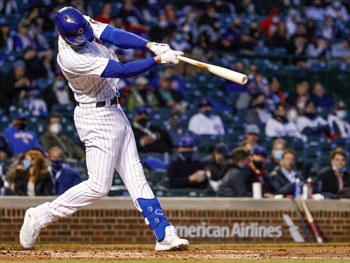 Apr 22, 2021; Chicago, Illinois, USA; Chicago Cubs third baseman Kris Bryant (17) hits a two-RBI double against the New York Mets during the third inning at Wrigley Field.